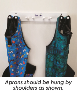 aprons hanging from rack